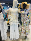 White ruffle top and tiered pants set